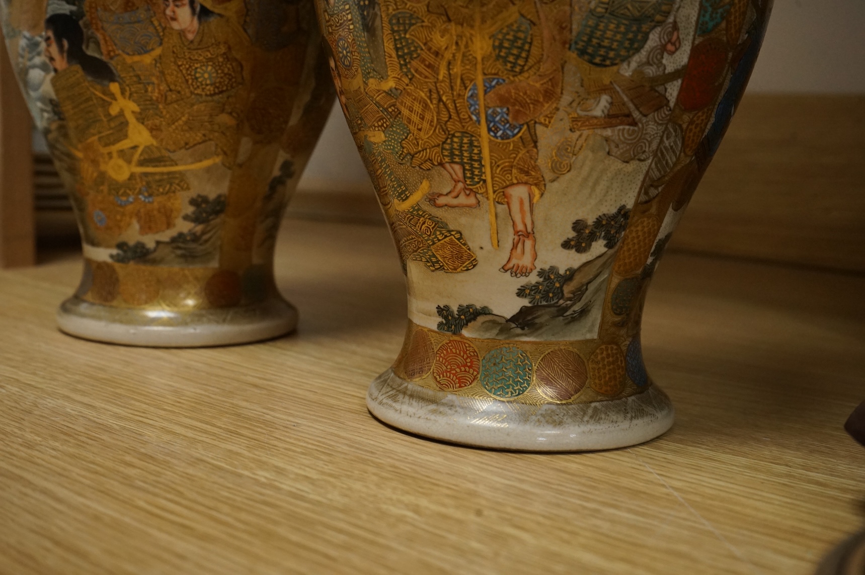 A pair of Japanese Satsuma pottery vases, Meiji period, 31cm high